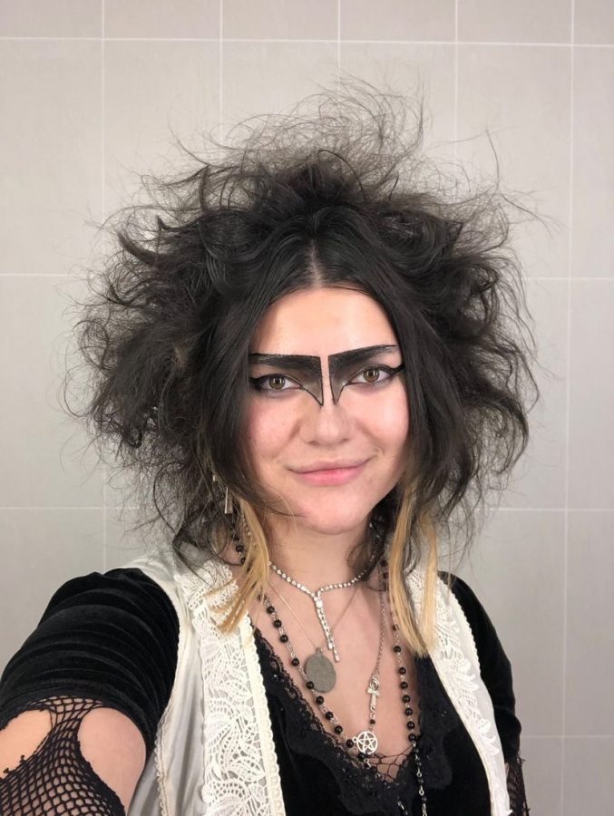Alyssa Lalos takes a selfie of her goth look. Lalos is inspired by 1980s goths, punks, and new wavers who made use of thrift stores, hand-me-downs, and sewing machines to craft their own unique outfits.