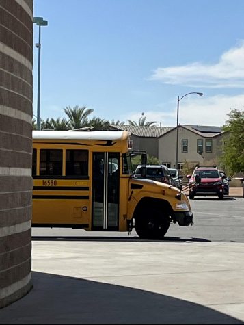 Bus waits outside Silverado after the bell rings.