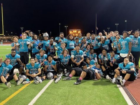 After playing a game against Desert Oasis on Oct. 22, the Varsity Football team celebrates their 76-20 win during senior night.