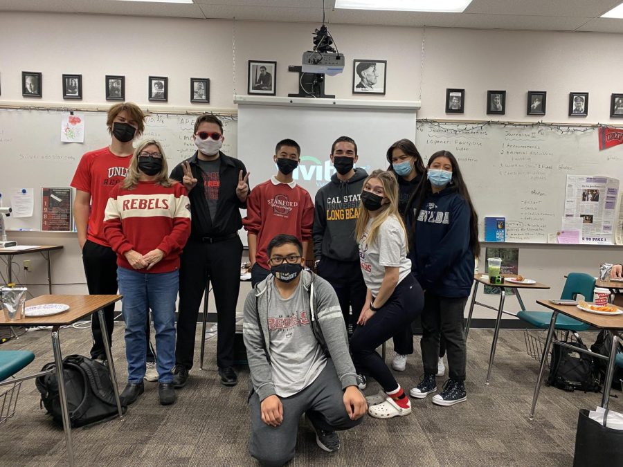 Mrs. Roybals English 101 dual credit class poses in college gear during winter finals week.