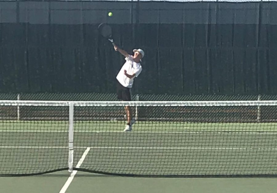 Shawn Carter (11) serves the ball during tiebreakers in a singles match against Sierra Vista on Sept. 1. 