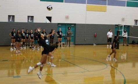 Isbell up to serve in a scrimmage match against Centennial HS at Silverado on Aug. 23.