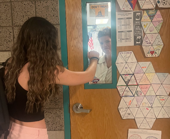 Photo illustration of senior McKenzie Dockery being locked out of Mrs. Pavlides’s classroom