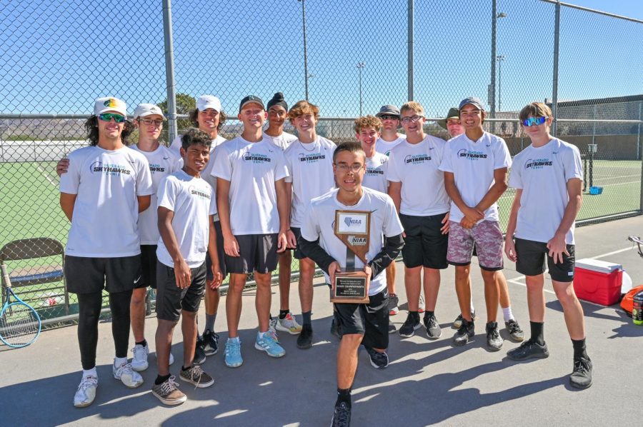 Mens tennis team proudly holds 2nd place trophy.