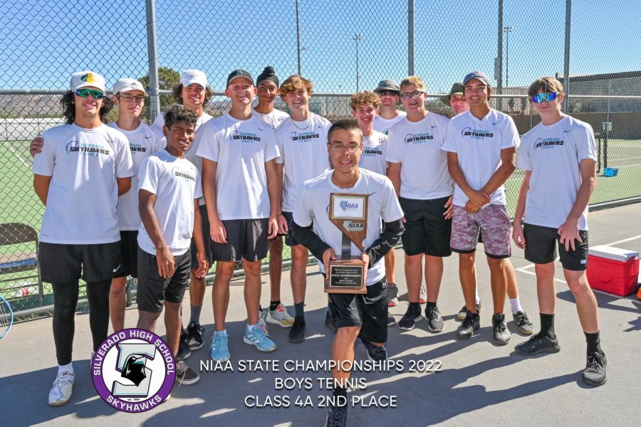 Mens Tennis team proudly holds 2nd place trophy on . 
