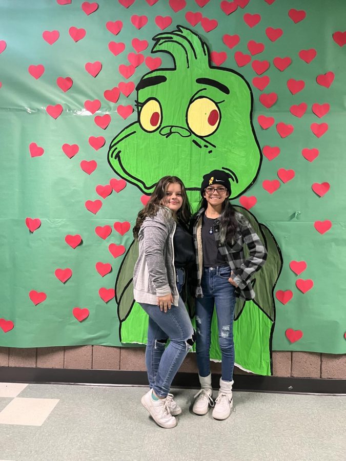 Freshmen Evelyn Layson and Sophia Narloch dress up in blue for Snow Miser in the Grinch hallway on Dec. 9.