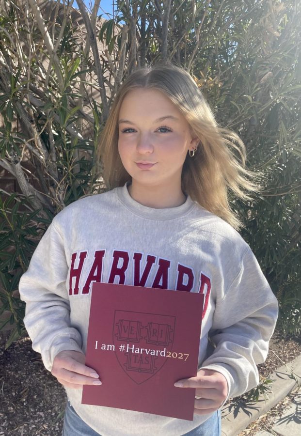 Senior Daniella Elge holds up her acceptance letter from Harvard, which she received Dec. 15.
